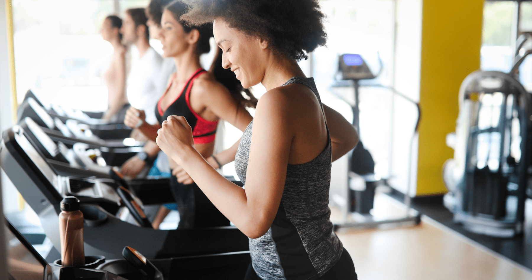 People exercising on treadmills at a gym